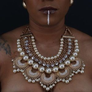 Gold toned necklace with pearls and rhinestone